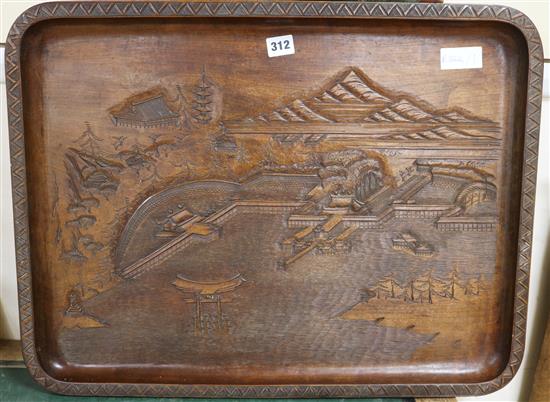 A carved wood Japanese tray